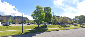 About MGC Contractors, A google street view of a parking lot with parked cars.