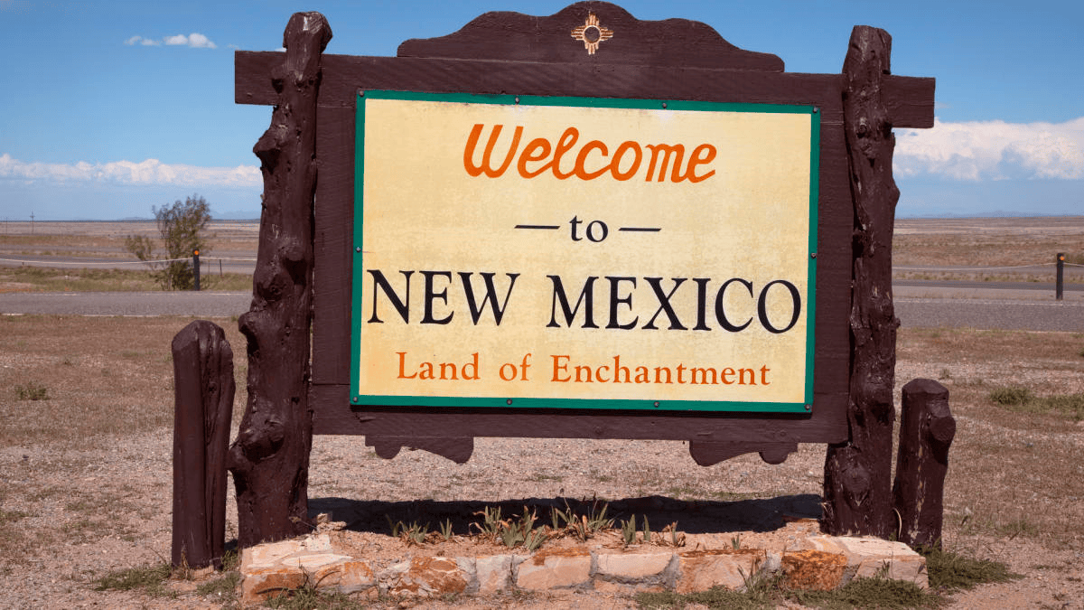 Welcome to new mexico land of enchantment sign, a symbol of mgc contractors' dedication to excellence.