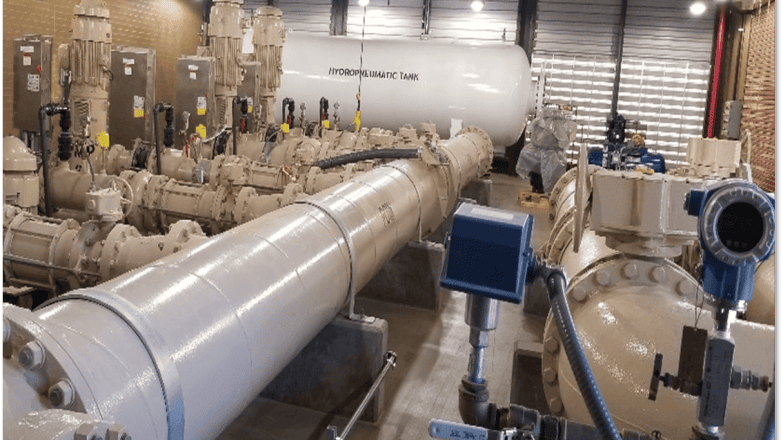 A large room filled with pipes and equipment.
