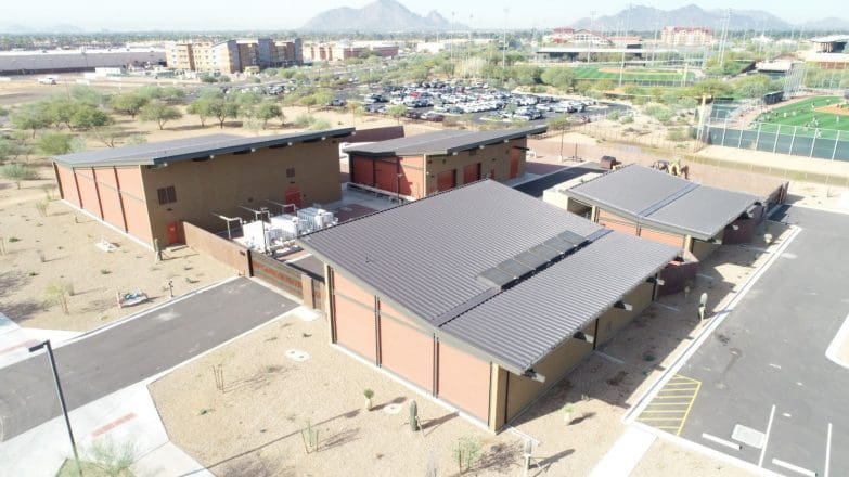 An aerial view of a building in the desert.